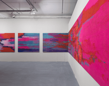 An installation shot of Gulnur Mukazhanova Shadows of Hope. Multicoloured felt canvases.