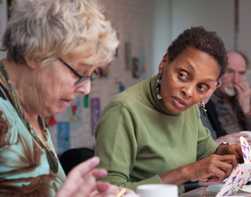 People working and talking at a craft table