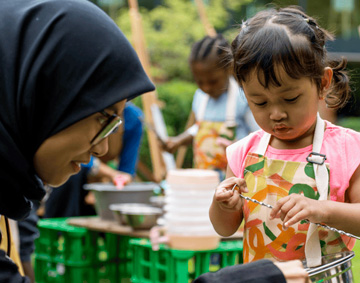 family outdoors in a park setting