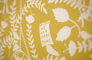 A group of midwives and maternity care providers sat around a crafting table. 