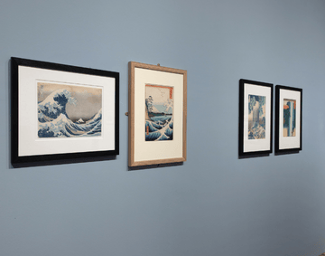 An installation photograph of prints from Beneath the Great Wave: Hokusai and Hiroshige Visitor Experience Tour