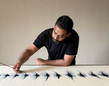 A photograph of the artist Kaimurai