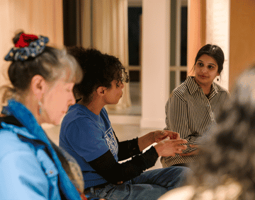 A group of women sat in a circle